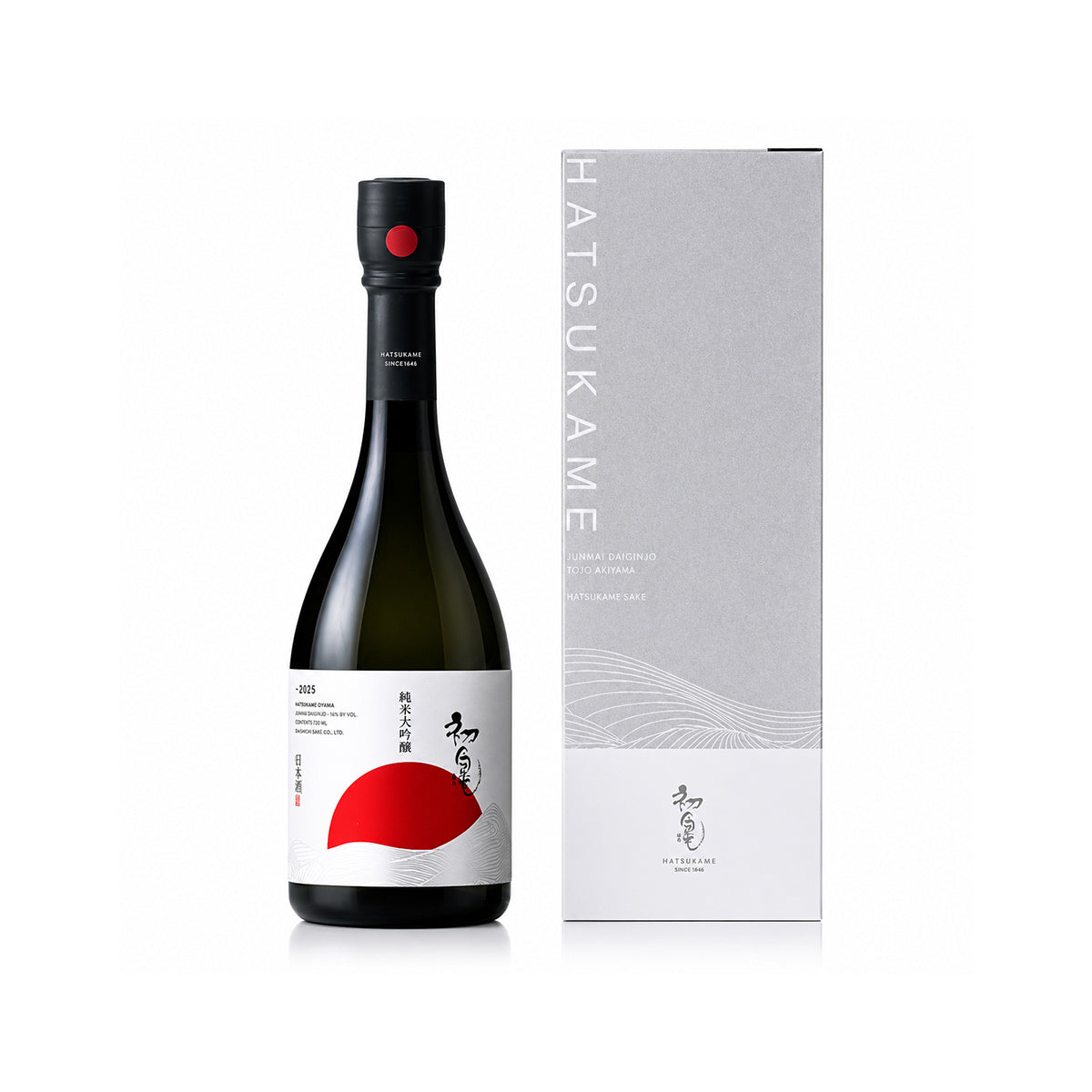 A bottle of Hatsukame-Junmai-Daiginjo-Tojo-Aiyama-Tajiri-Farsake with a black cap and a white label featuring a bold red shape, standing next to its tall light gray and white box. The brand name HATSUKAME is printed vertically on the box.